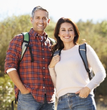 Man and woman smiling outdoors