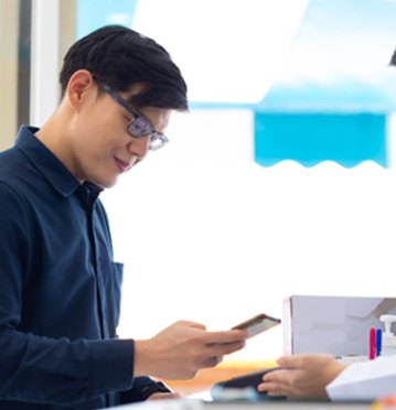 Man making payment in medical office