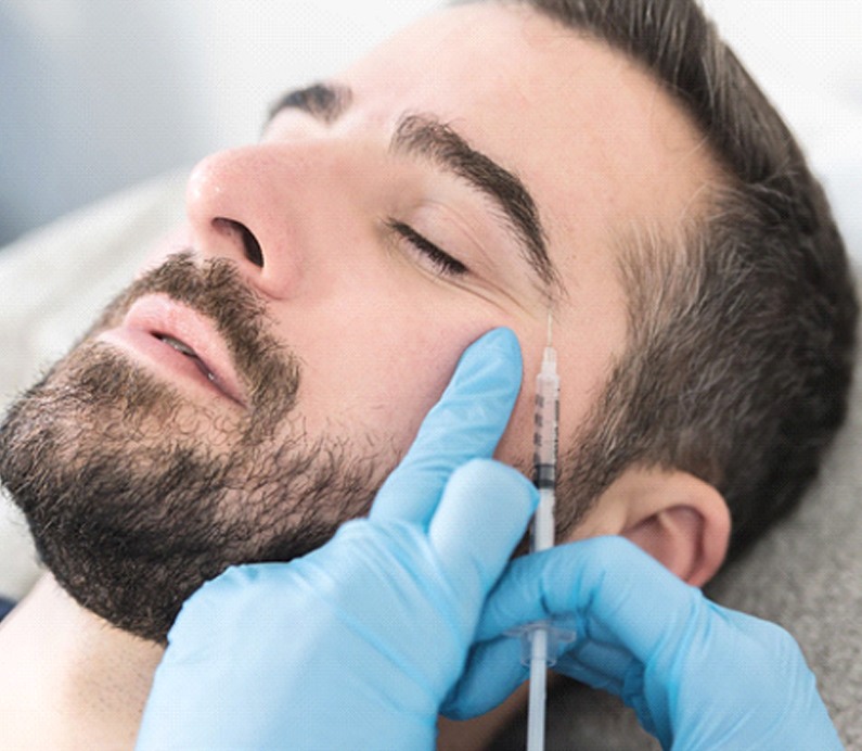 Bearded man receiving injection for Botox in Albuquerque