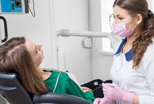 Dentist examining patient in Albuquerque