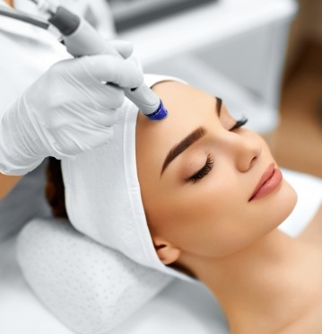 Woman receiving laser skin treatment