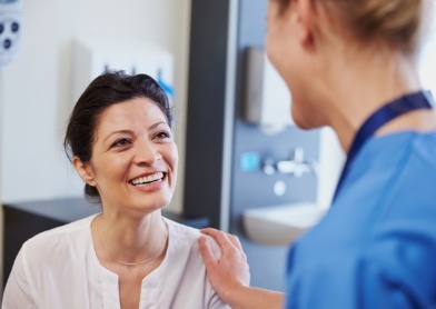 Woman talking to dentist