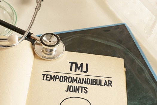 TMJ document next to stethoscope and X-ray