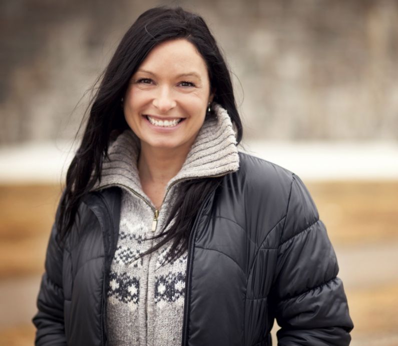 Woman smiling after receiving sleep medicine