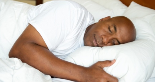 Man sleeping soundly thanks to sleep apnea treatment