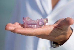 Custom oral appliance for sleep apnea therapy