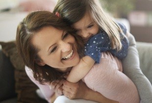 Mother laughing with her child