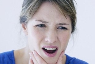 Woman in pain due to bruxism